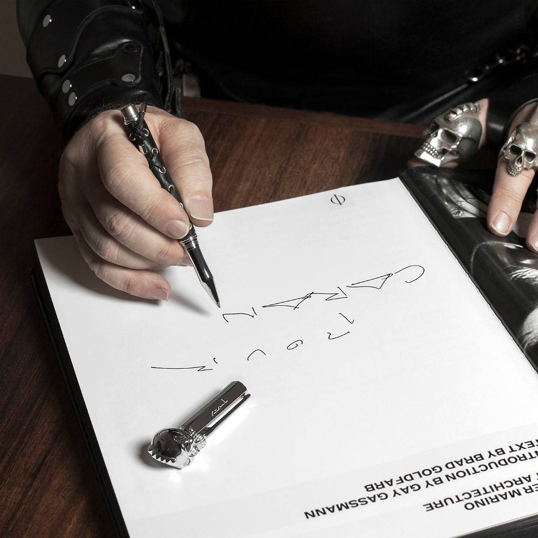 Peter Marino signing his Phaidon book with his Varius pen. All images courtesy of Caran d'Ache's instagram 