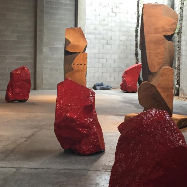 A series of untitled glazed and fired lava rocks by Bosco Sodi (foreground), as installed at the Noguchi Museum, as part of Museum of Stones. Image courtesy of the museum's Instagram