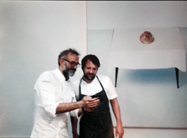 René Redzepi and Bottura with the staff at Refettorio Ambrosiano. Image courtesy of Bottura's Instagram