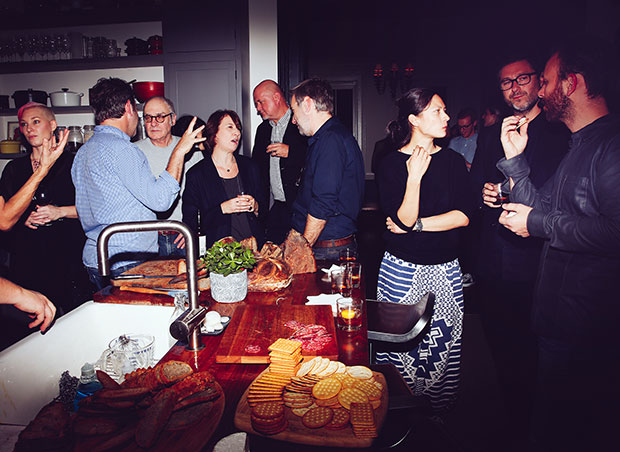 Guests enjoy aperitifs at Adam Sachs’ Brooklyn house. Photograph by Michelle Heimerman