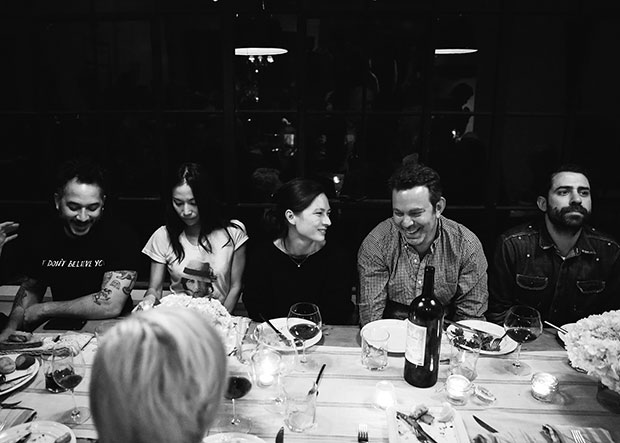 Guests enjoy Magnus's food at Adam Sachs’ Brooklyn house. Photograph by Michelle Heimerman