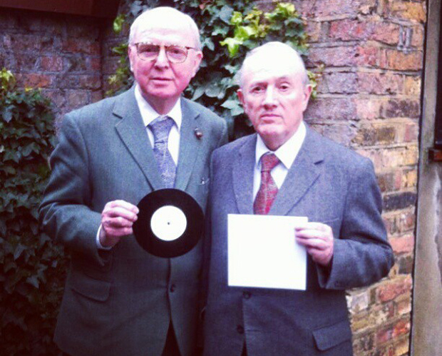Gilbert & George with their bare sleeve. Courtesy of Secret 7