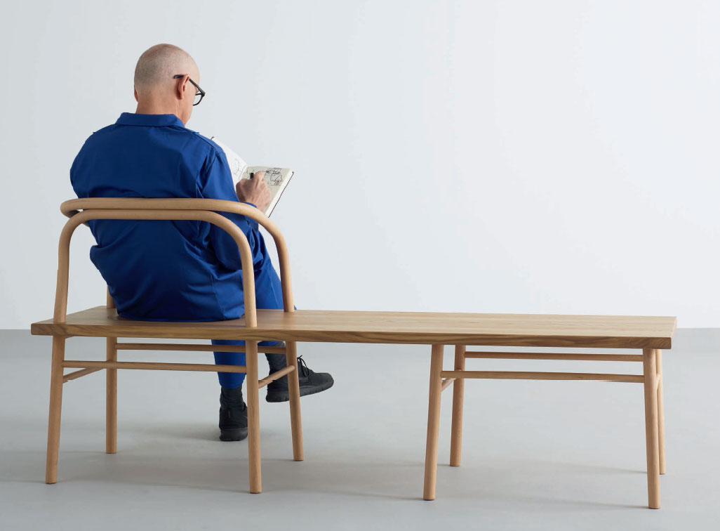Fellow designer Durrell Bishop sitting on Industrial Facility's Table, Bench, Chair. As reproduced in our book, Industrial Facility