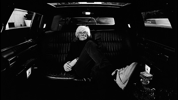 Andy Warhol in a limousine in New York City in 1986, by Elliott Erwit