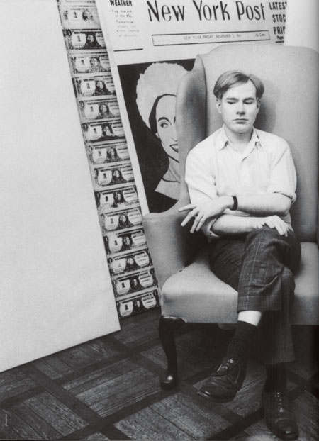 Warhol with his dollars, in his studio, 1962