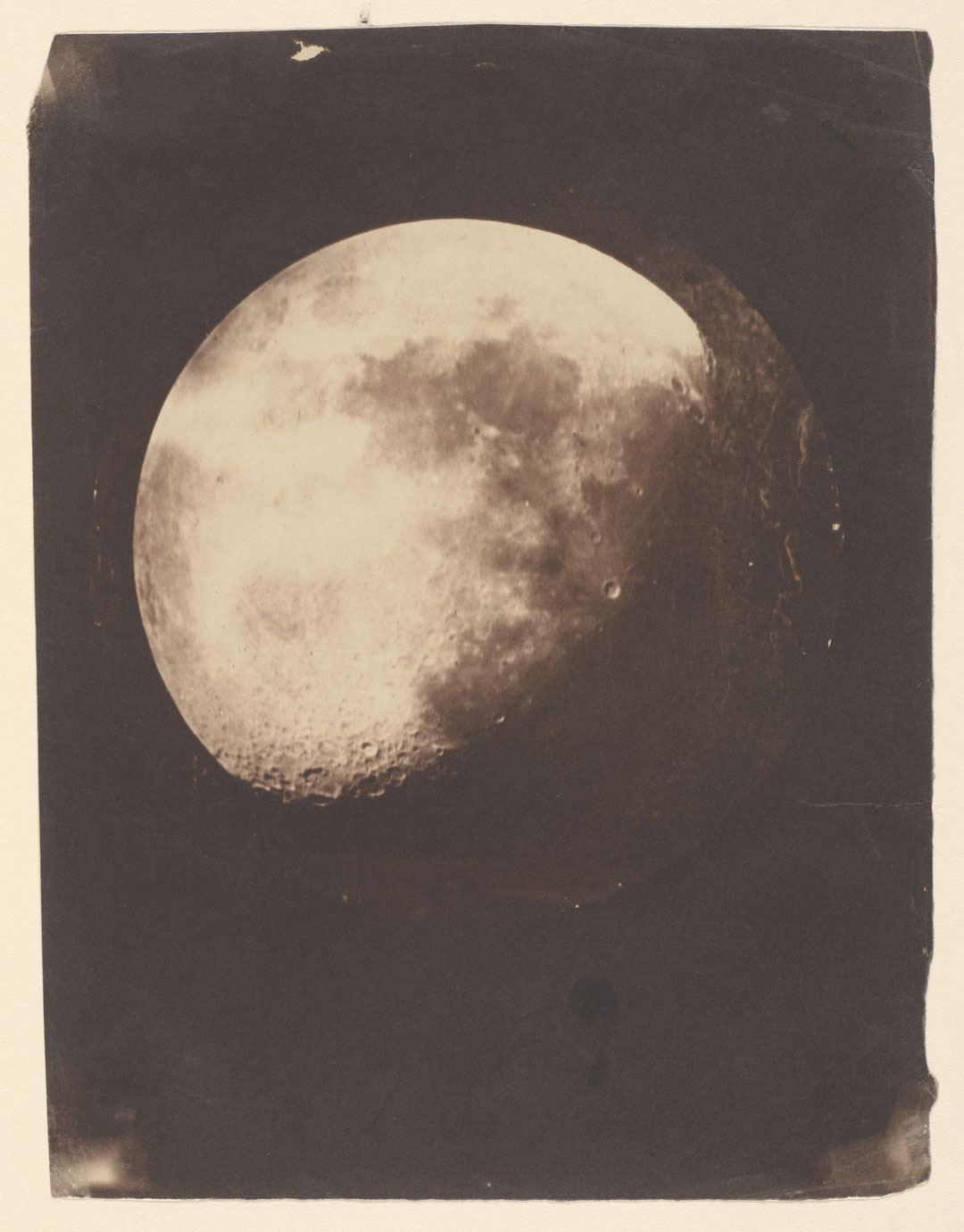 John Adams Whipple and James Black, The Moon, 1857–60, salted paper print made from a glass negative, 21.1 × 15.8 cm (8¼ × 6¼ in), copy of a daguerreotype made 193 at Harvard College Observatory, Cambridge, Massachusetts, Metropolitan Museum of Art, New York. Public domain. As reproduced in Sun and Moon