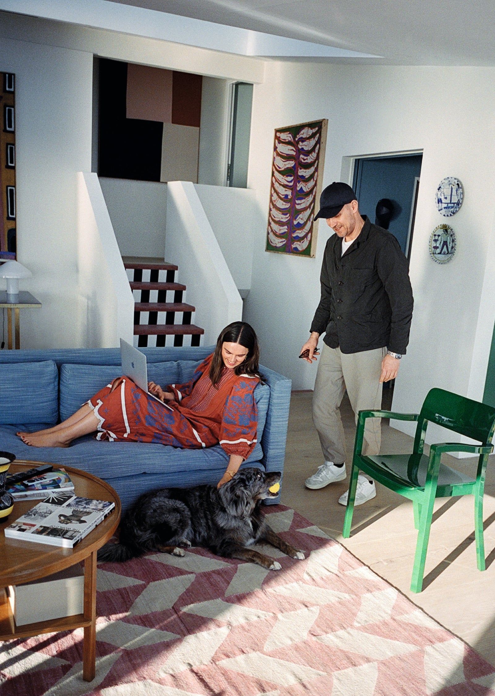 Mette and Rolf with their dog Lola at their home in Denmark. Photo by Jody Barton