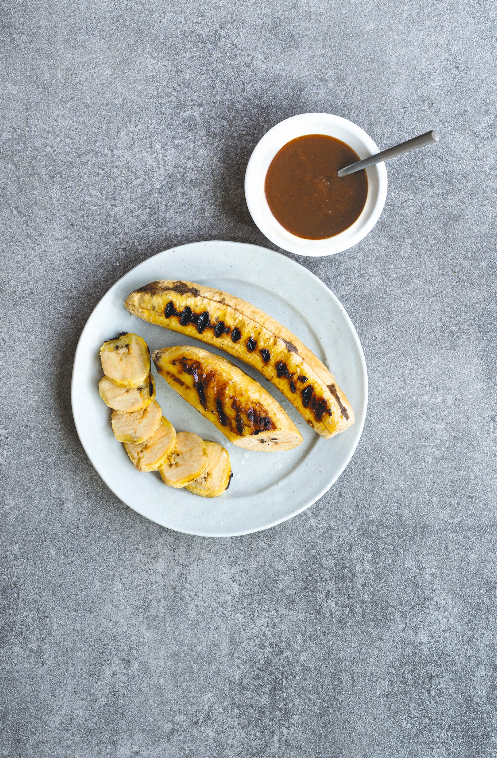 Grilled plantain with palm sugar sauce. From The Gluten-Free Cookbook. Photography by Infraordinario Studio.