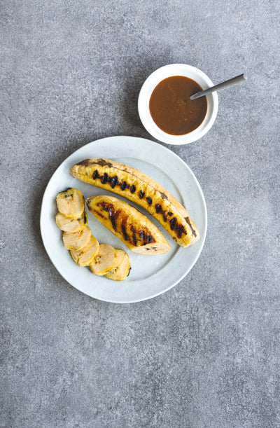 Grilled plantain with palm sugar sauce. From The Gluten-Free Cookbook. Photography by Infraordinario Studio.