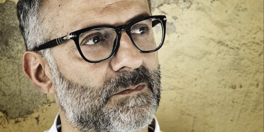 Massimo Bottura interview portrait chef kitchen background