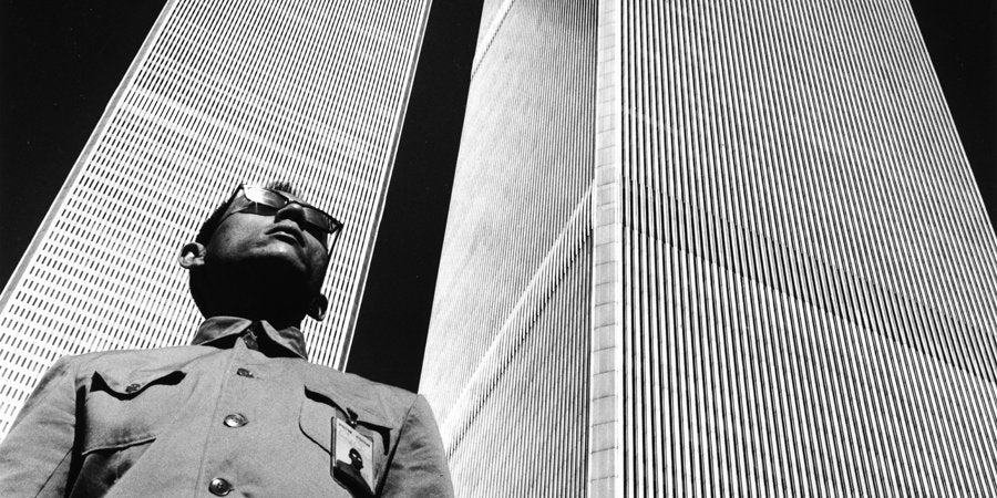 tseng kwong chi black and white portrait photography artist holding camera outdoors urban background