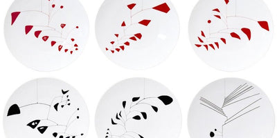 Conversation piece Alexander Calder plates colorful abstract art on white background