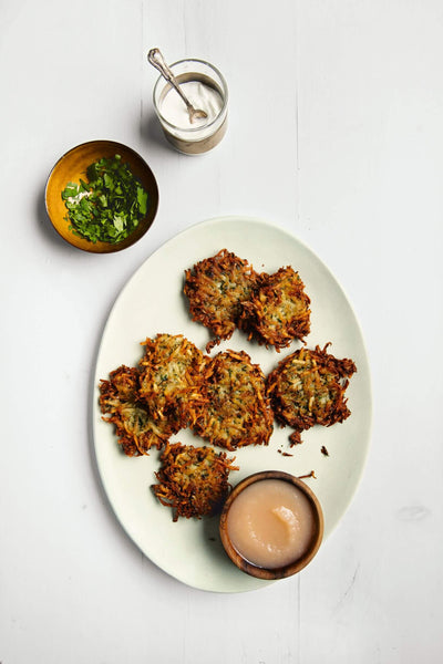 potato latkes crispy golden brown traditional Jewish dish served with sour cream and applesauce