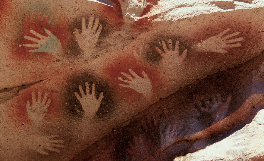 rock art painting on cave wall with human and animal figures in earthy tones