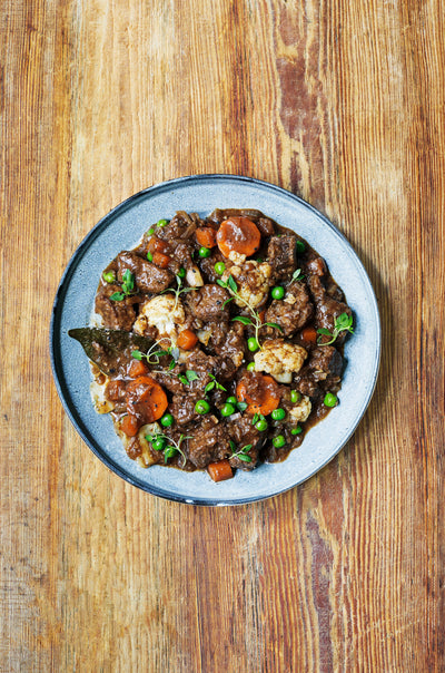 Beef stew with carrots, cauliflower, and cabbage. Photography by Luke Albert