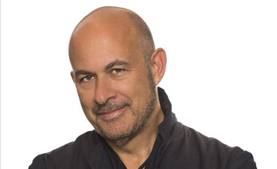 John Varvatos interview promotional image with logo and stylish background