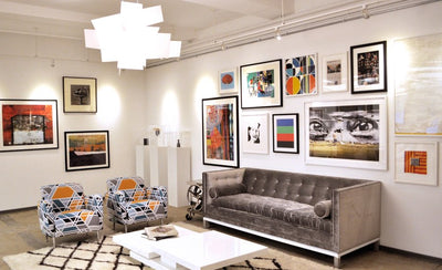 how to hang your art salon style wall with multiple framed artworks arranged in a gallery layout
