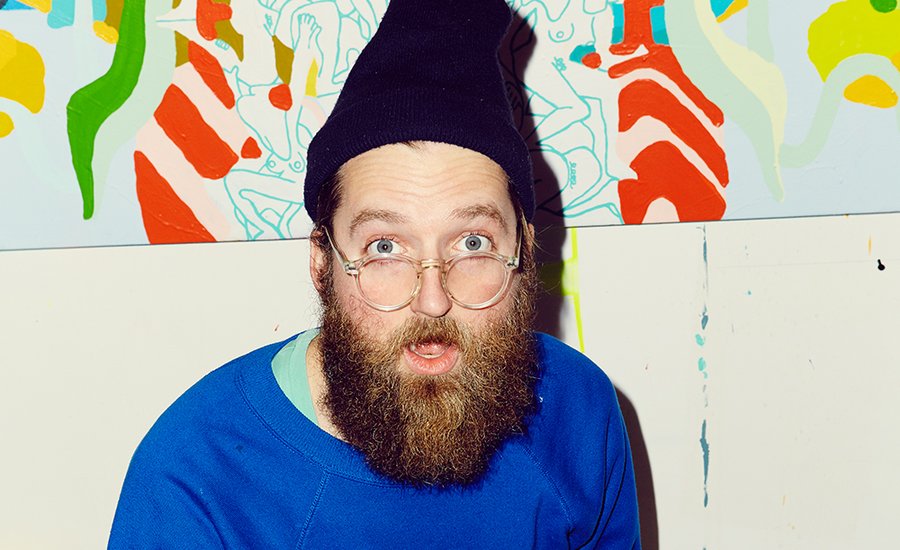 Mike Perry interview portrait with microphone on stage background