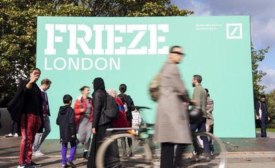 Frieze London art fair exterior view with visitors and modern sculptures on display in daylight