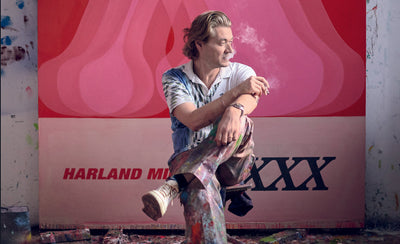 Harland Miller artist portrait with artwork background discussing art life and creativity