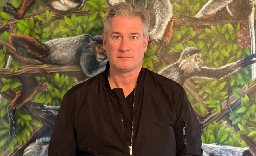 Garrett Chingery artist portrait with direct gaze against neutral background