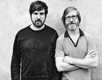 dan and jeppe smiling outdoors casual clothing natural background