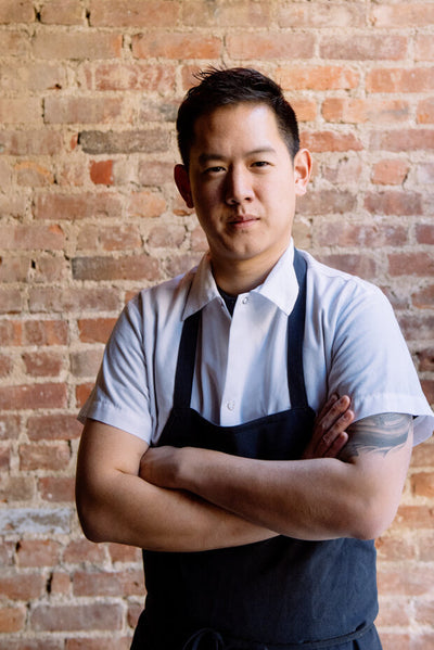 Jeremiah Stone professional headshot outdoors with Contra and Wildair logos in background