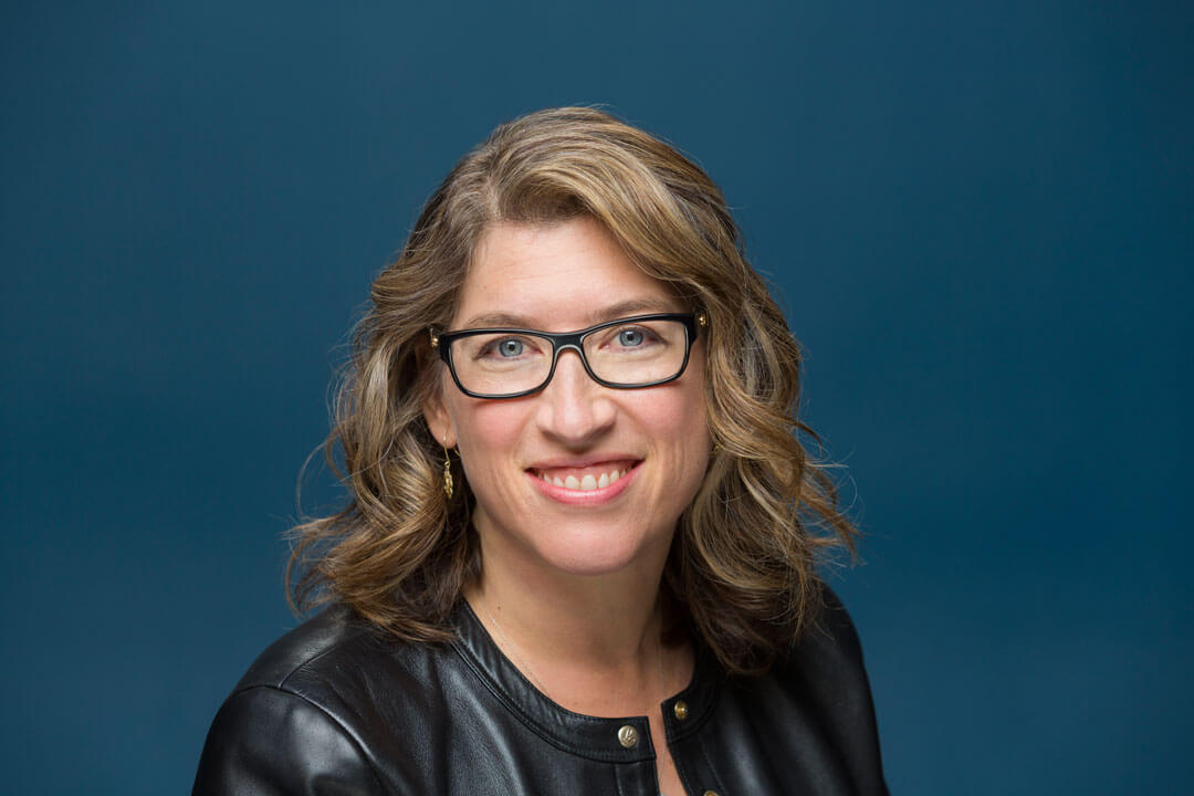 Lauren Greenfield portrait photographer holding camera outdoors natural light