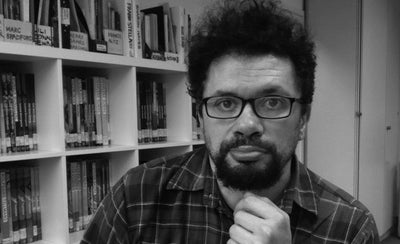 portrait of Michele smiling outdoors with natural background