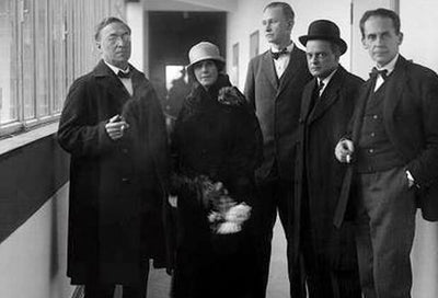 black and white photograph of Bauhaus family members standing together outside a building