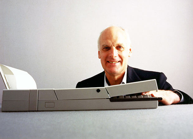 portrait of Richard Sapper industrial designer with glasses and beard against neutral background