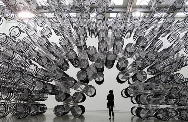 Weiwei Forever Bicycles art installation featuring numerous white bicycles arranged in a circular pattern