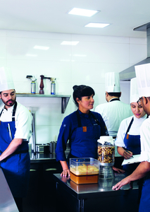 Manoella ‘Manu’ Buffara and team members preparing for dinner service. Photography by Helena Peixoto