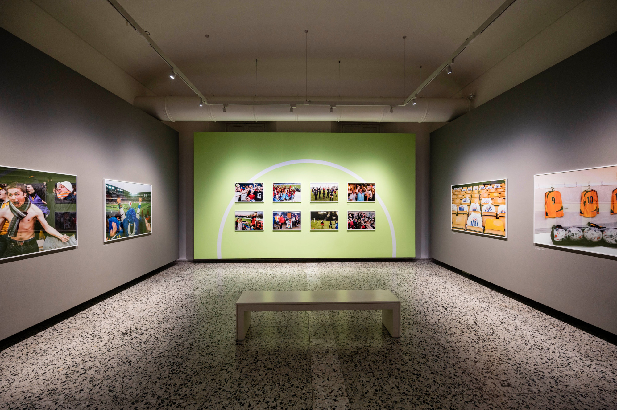 Installation view of Martin Parr. We Love Sports. Installation photograph by Andrea Guermani