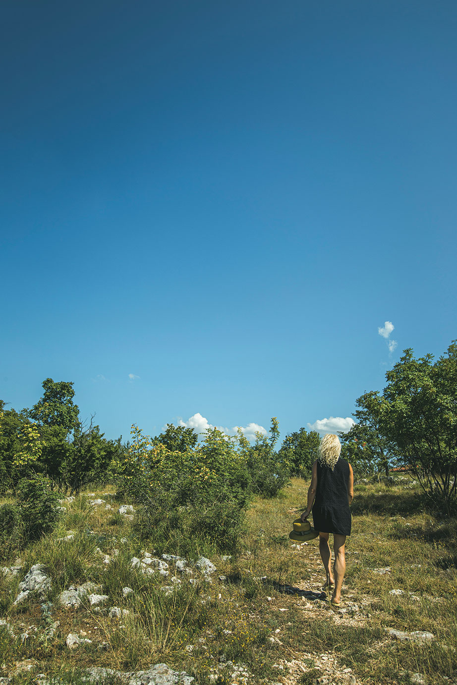 Ana Roš in the Slovenian mountains, as reproduced in Ana Roš: Sun and Rain