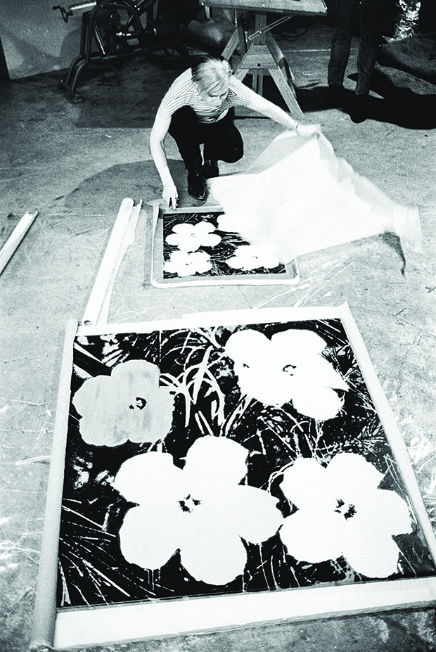 Andy Warhol silk-screening Flowers, 1965-7. © Stephen Shore
