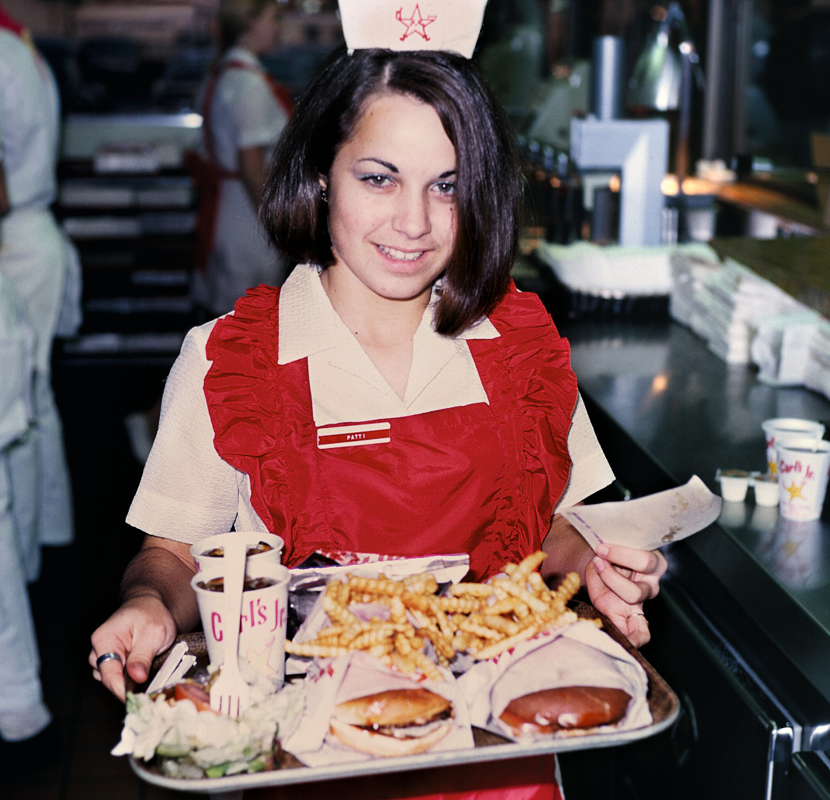 A waitress at Carl's Jr. as reproduced in The World is Your Burger