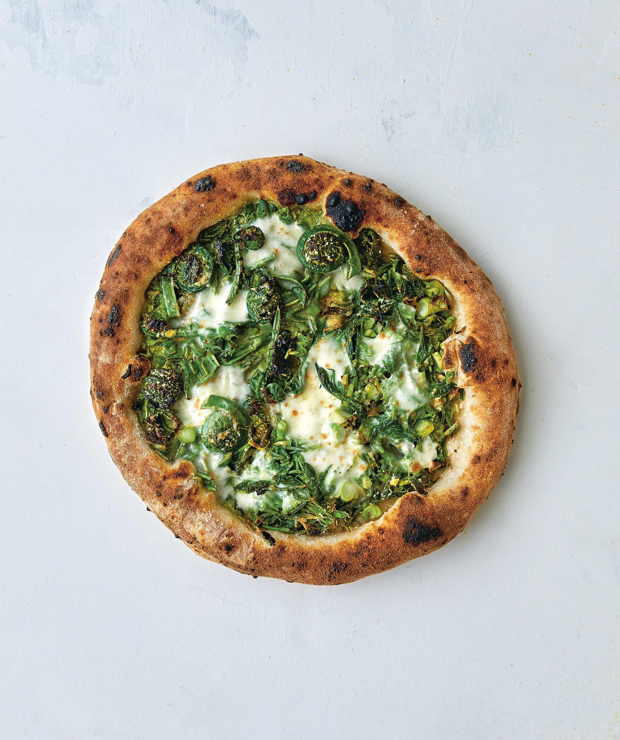 Fiddlehead fern and koshiabura pizza