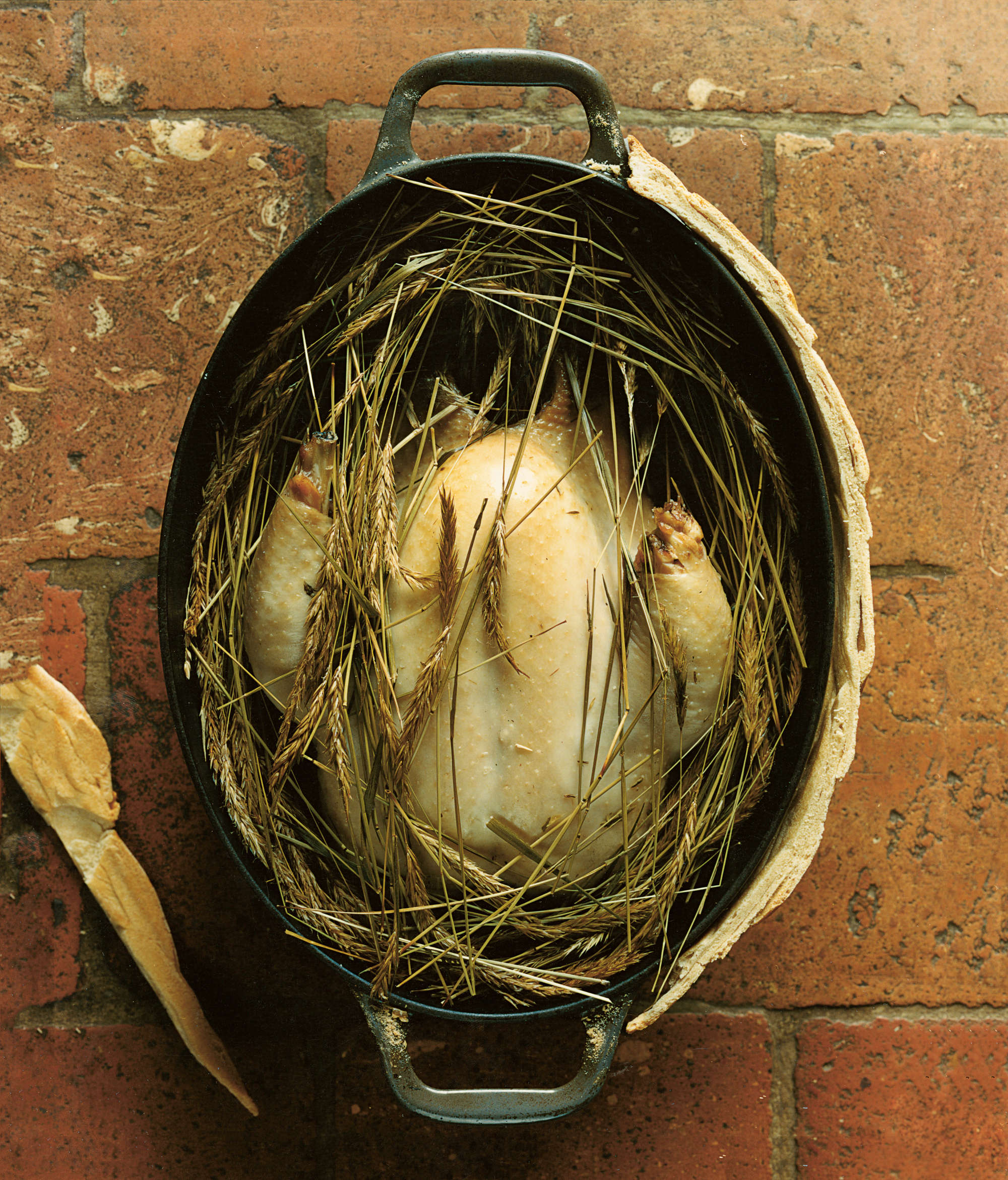 Free-range chicken with sweet vernal grass cooked in a dough-sealed pot. Photograph by Alexandre Guirkinger