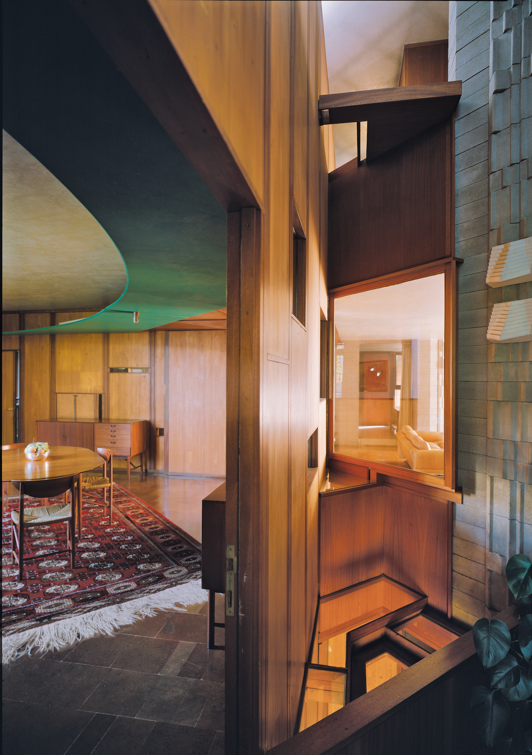 Veritti House, Udine, 1955-6; view of dining room (l) and vertical light-well (r). © Aldo Ballo