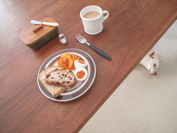 Multigrain bread, carrot and kaki (Japanese persimmon) salad, boiled egg, café au lait, and a dog. I should really cut back on the carbs … zzzzz. From Bread and a Dog