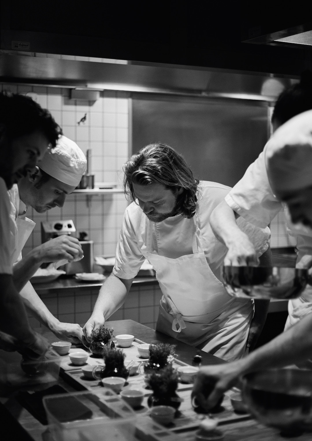 Plating Porridge of grains and seeds from Jämtland finished with a lump of salty butter. Photograph by Erik Olsson