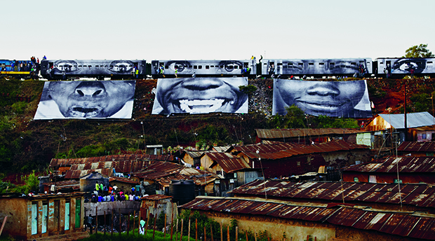 Women are Heroes: Train passing, Kibera, Kenya, 2009,  by JR