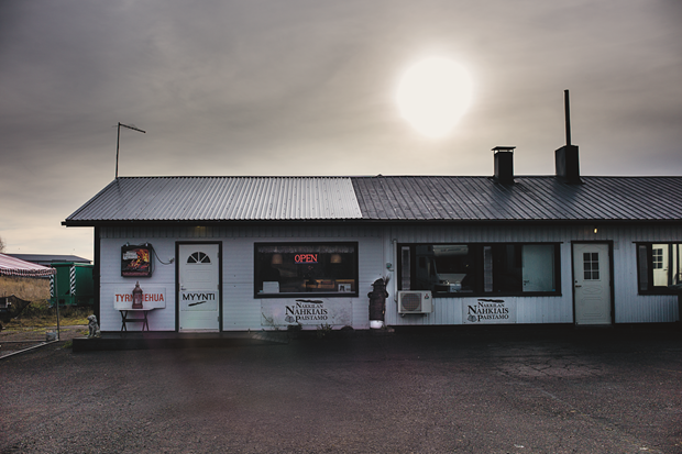 A house next to a West Finnish Highway, Autumn (Fall) 2013. Inside the house lampreys are being grilled and sold. Photograph by Magnus Nilsson. From The Nordic Cookbook