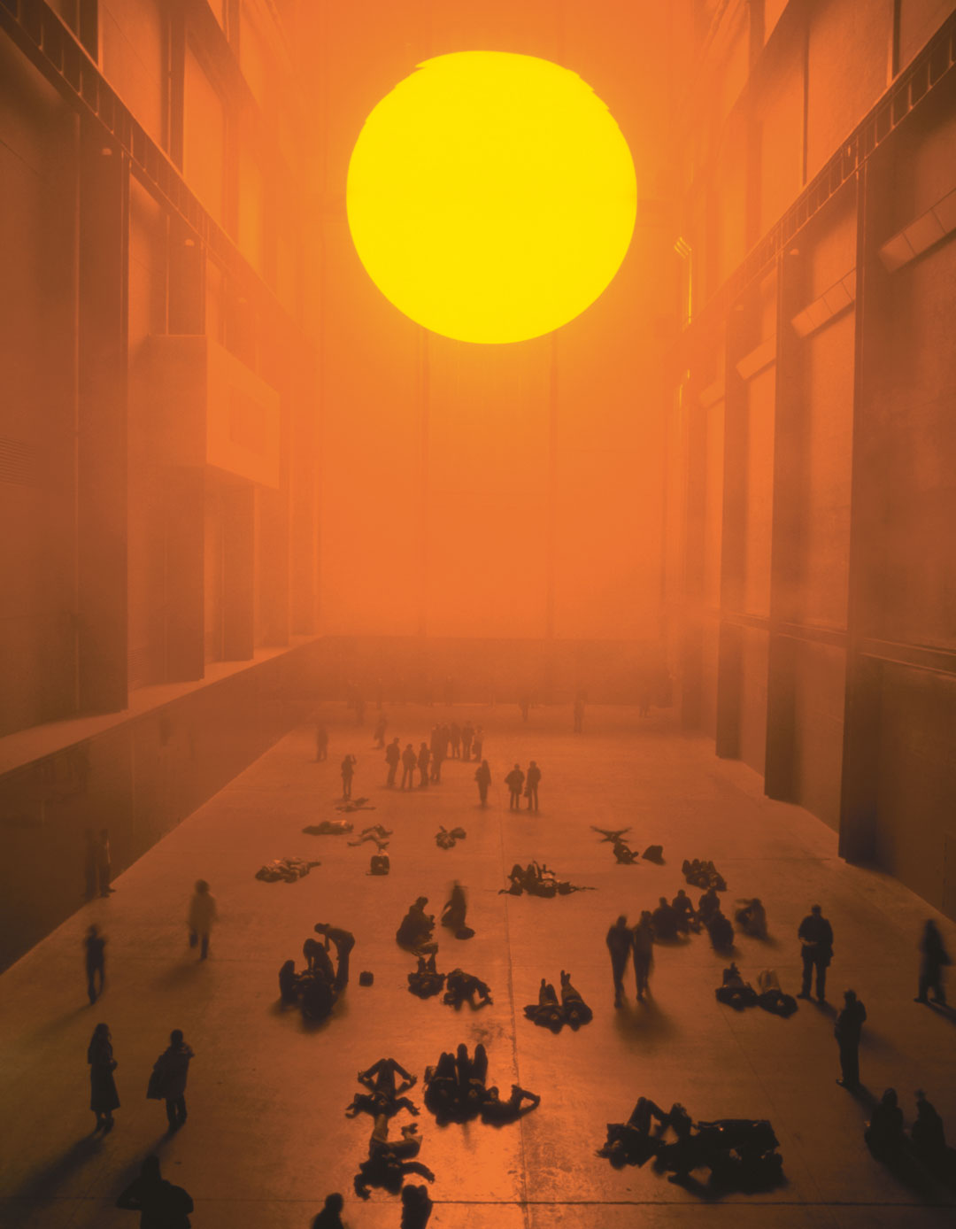 The weather Project, 2003, monofrequency lamps, projection screen, haze machines, foil mirror, aluminium, scaffolding, 26.7 x 22.3 x 155.44 m (87 5/8 x 73 1/8 x 510 ft), installation view at Tate Modern, London, 2003. Picture credit: Tate photography, Andrew Dunkley & Marcus Leith