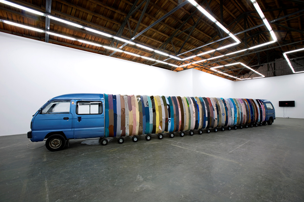 Collective Subconscious (Blue), 2007, minivan, stainless steel, used clothes, stool, music, 140 x 190 x 1420 cm, installation view at Beijing Commune, 2007