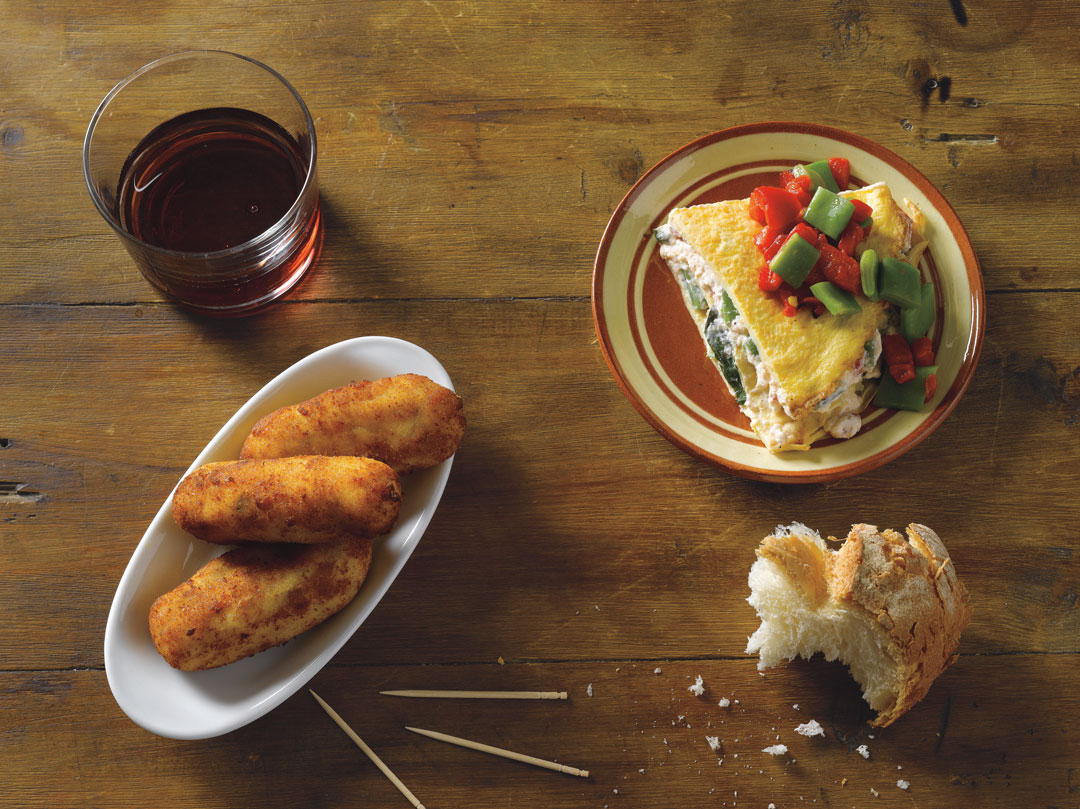 Cheese and egg croquettes and tortilla 'cake' with cheese and beans