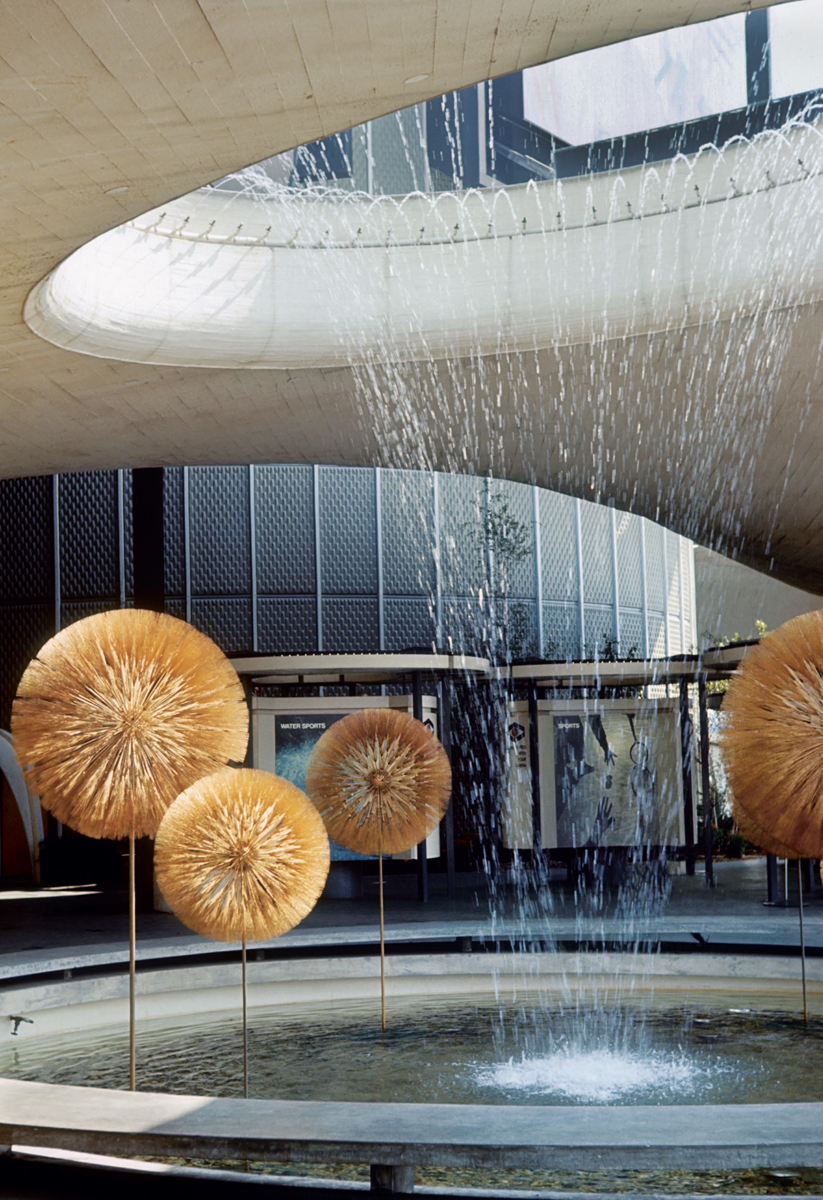 Six dandelion sculptures by Harry Bertoia at the basin and fountain, Eastman Kodak Pavilion, New York World’s Fair, 1964. As featured in Bertoia: The Metal Worker