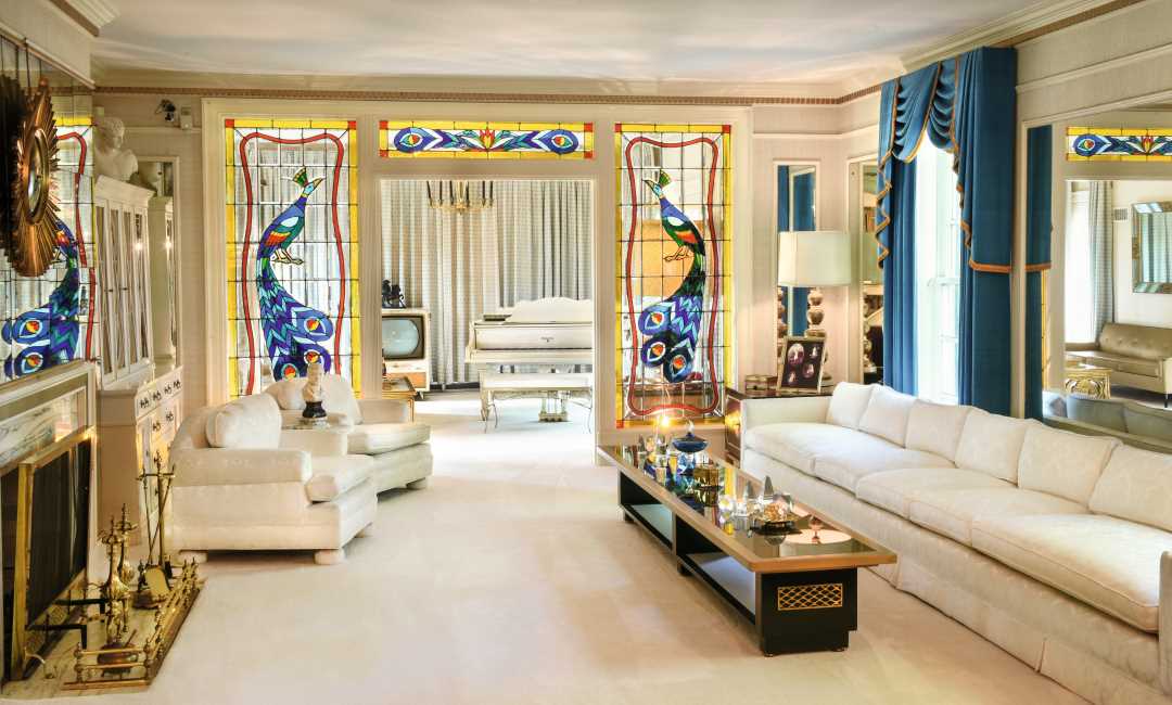 The living room and music room at Graceland, Memphis, Tennessee, USA. Open to the public. Singer, actor. Courtesy of Elvis Presley Enterprises, Inc