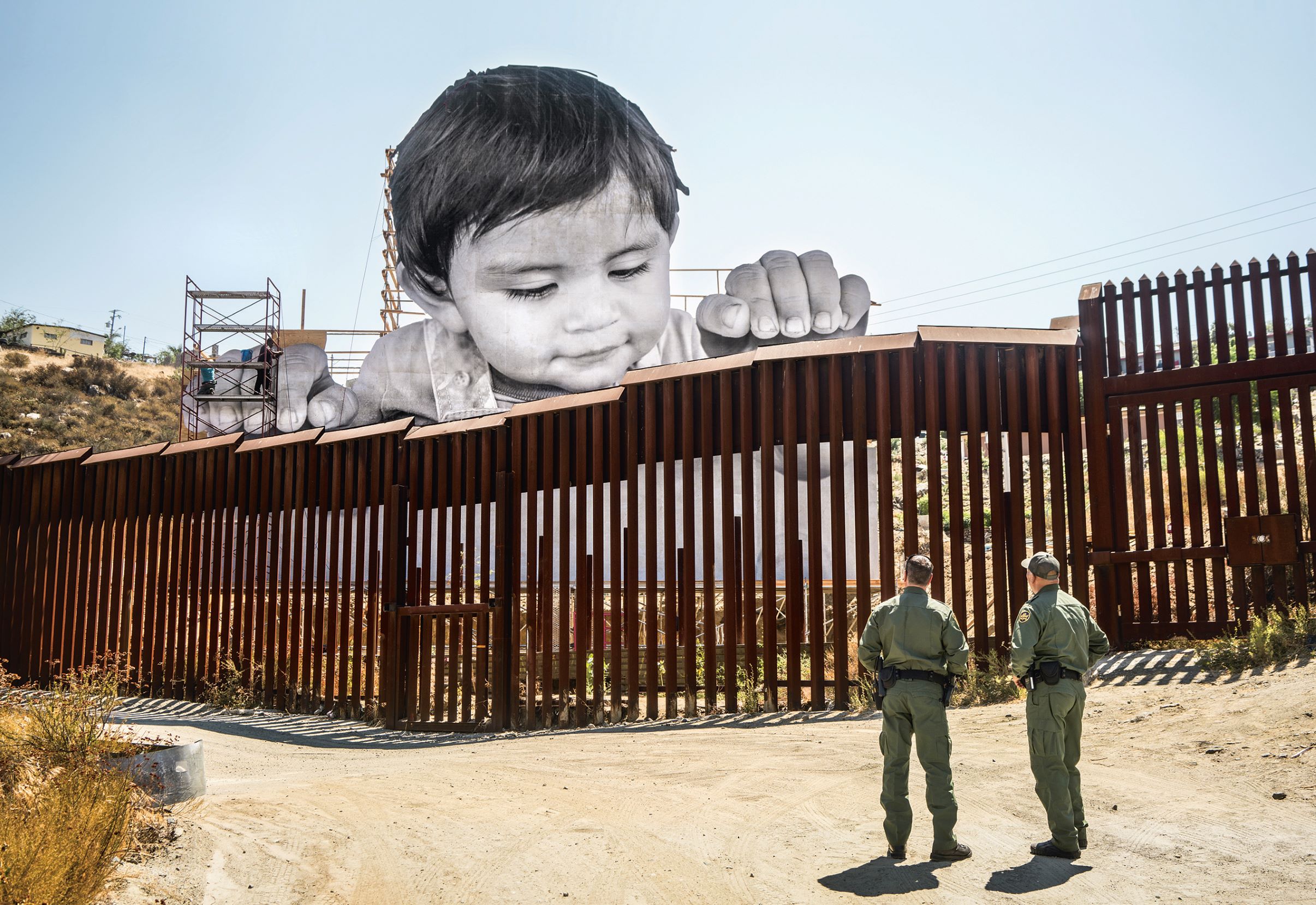 Kikito and the border patrol, Tecate, Mexico–USA border, 2017. Laurent Segretier, courtesy Galerie Perrotin / artwork © JR 